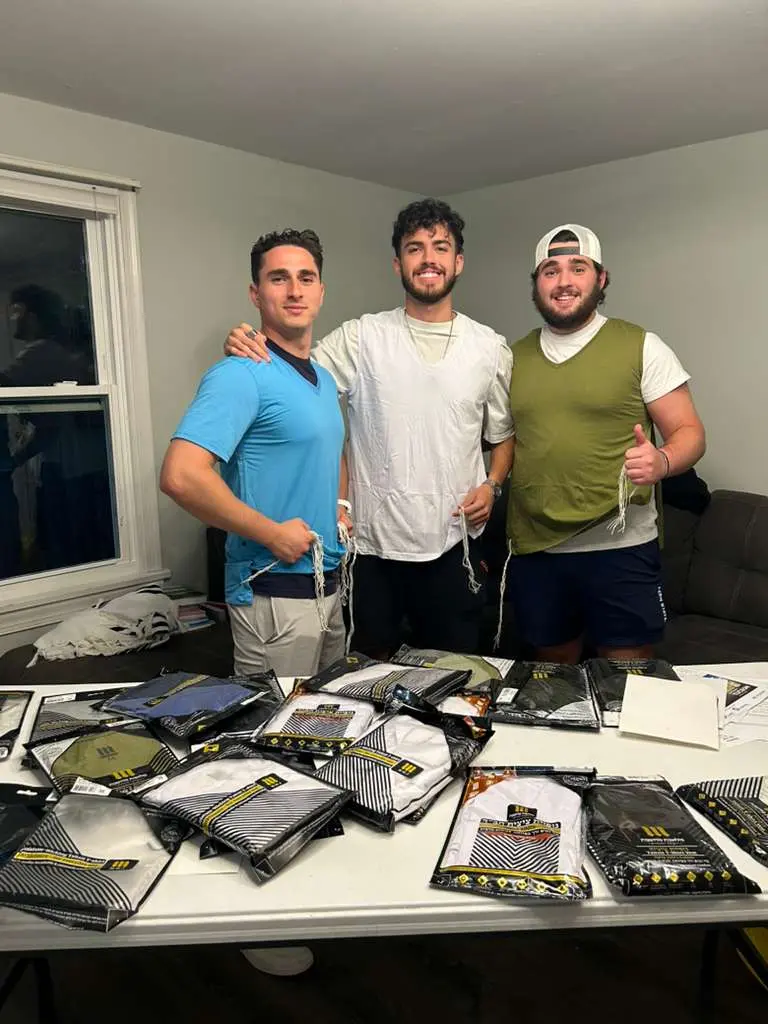 College students receiving sponsored tzitzit at Chabad campus