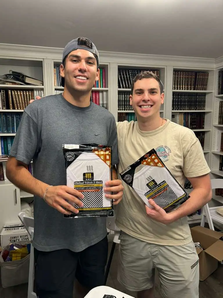 Campus students wearing VeAhavta tzitzit shirts